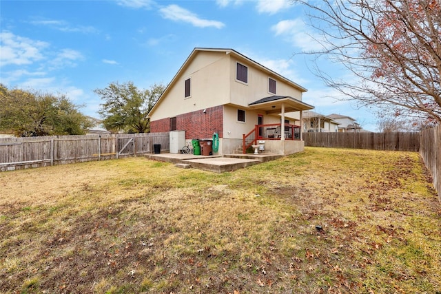 1610 Plume Grass Pl, Round Rock, TX 78665 - rear view of house with a patio, stucco siding, and brick siding