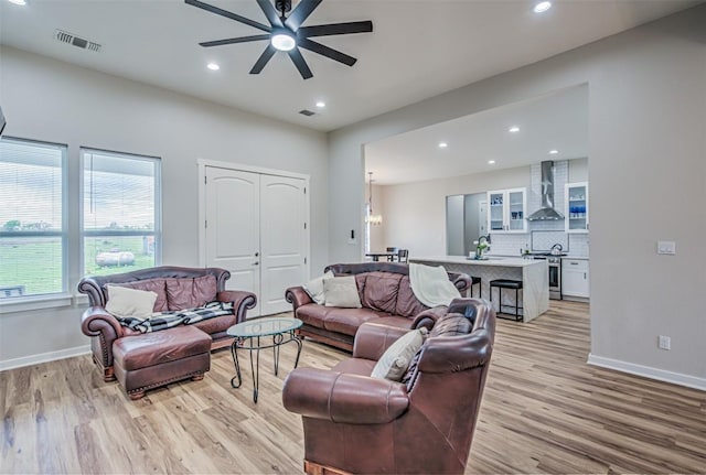 171 Eely Rd, Mcdade, TX 78650 - living room featuring light wood-style floors, ceiling fan, recessed lighting, and baseboards