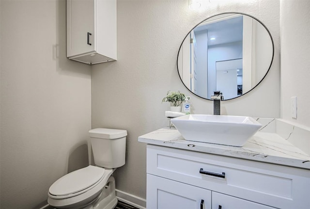 171 Eely Rd, Mcdade, TX 78650 - bathroom featuring vanity, toilet, and baseboards