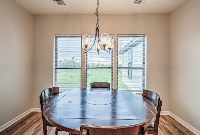 171 Eely Rd, Mcdade, TX 78650 - dining room with a chandelier, plenty of natural light, and wood finished floors