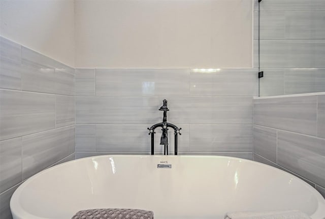 171 Eely Rd, Mcdade, TX 78650 - full bath featuring tile walls and a freestanding bath