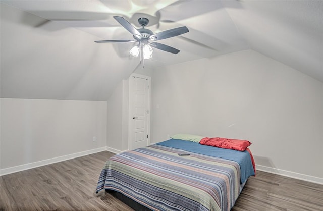171 Eely Rd, Mcdade, TX 78650 - bedroom with vaulted ceiling, wood finished floors, baseboards, and a ceiling fan