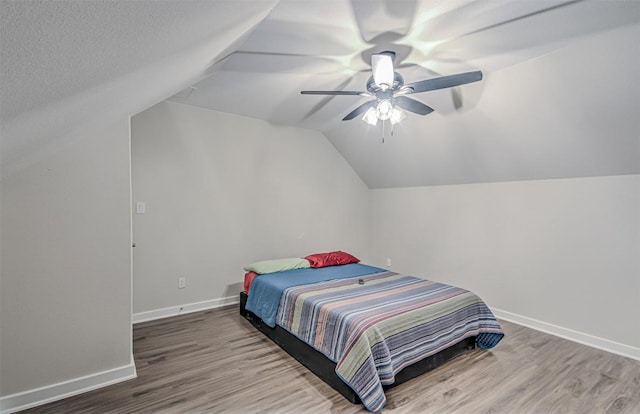 171 Eely Rd, Mcdade, TX 78650 - bedroom with wood finished floors, vaulted ceiling, baseboards, and a ceiling fan