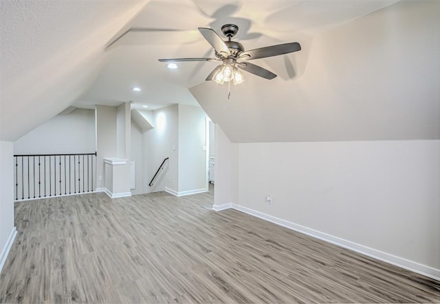 171 Eely Rd, Mcdade, TX 78650 - bonus room featuring light wood-style floors, lofted ceiling, a ceiling fan, baseboards, and recessed lighting