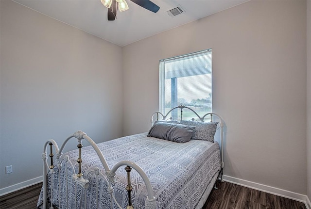 171 Eely Rd, Mcdade, TX 78650 - bedroom with baseboards, dark wood-style floors, and a ceiling fan