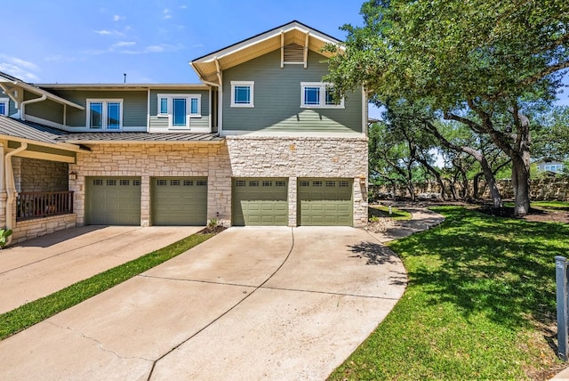 2930 Grand Oaks Loop Unit 401, Cedar Park, TX 78613 - view of front of home featuring stone siding, a garage, and driveway