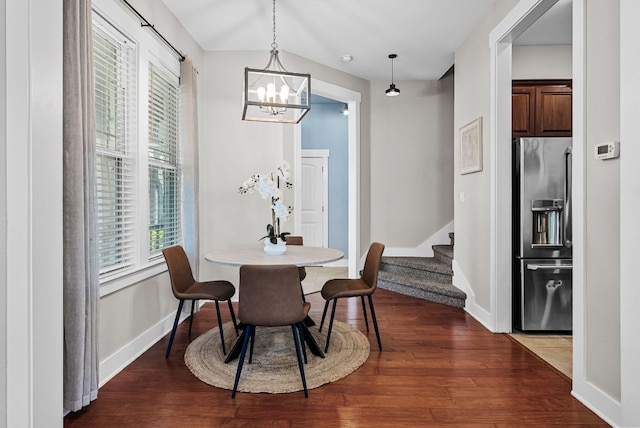 2930 Grand Oaks Loop Unit 401, Cedar Park, TX 78613 - dining space with stairs, a chandelier, wood finished floors, and baseboards