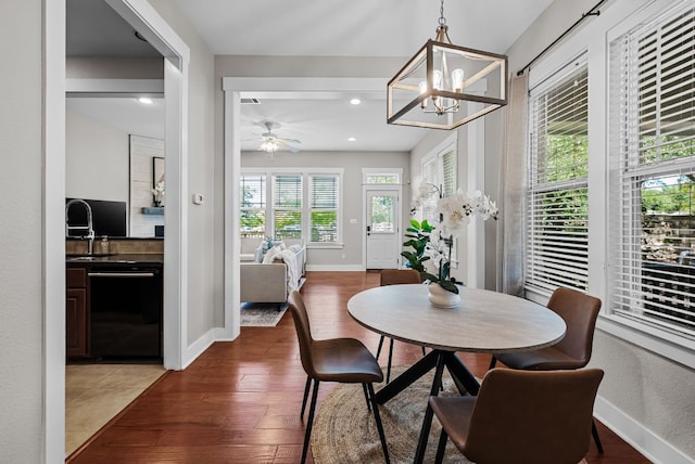 2930 Grand Oaks Loop Unit 401, Cedar Park, TX 78613 - dining space featuring wood finished floors, a chandelier, baseboards, and recessed lighting