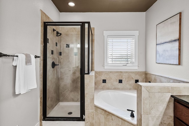 2930 Grand Oaks Loop Unit 401, Cedar Park, TX 78613 - full bathroom featuring a shower stall, a garden tub, and vanity