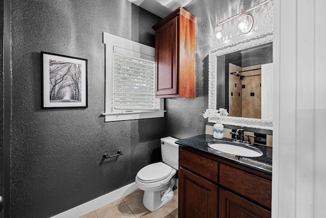 2930 Grand Oaks Loop Unit 401, Cedar Park, TX 78613 - bathroom featuring a textured wall, tile patterned flooring, toilet, a shower, and baseboards