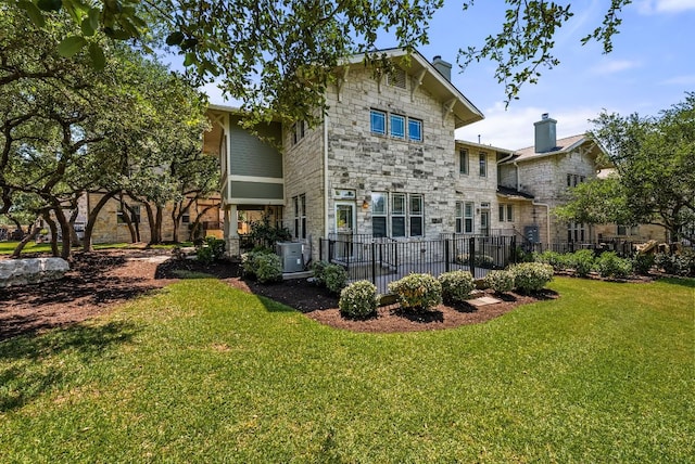 2930 Grand Oaks Loop Unit 401, Cedar Park, TX 78613 - back of house featuring stone siding