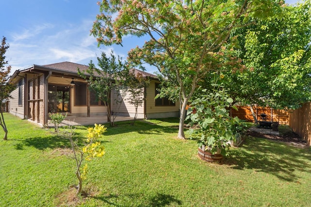 366 Matthews Ln, Kyle, TX 78640 - fenced backyard featuring a patio area and a ceiling fan
