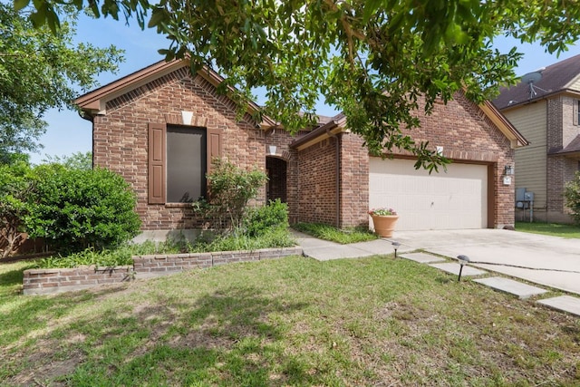 366 Matthews Ln, Kyle, TX 78640 - view of front of property with concrete driveway, a front lawn, an attached garage, and brick siding