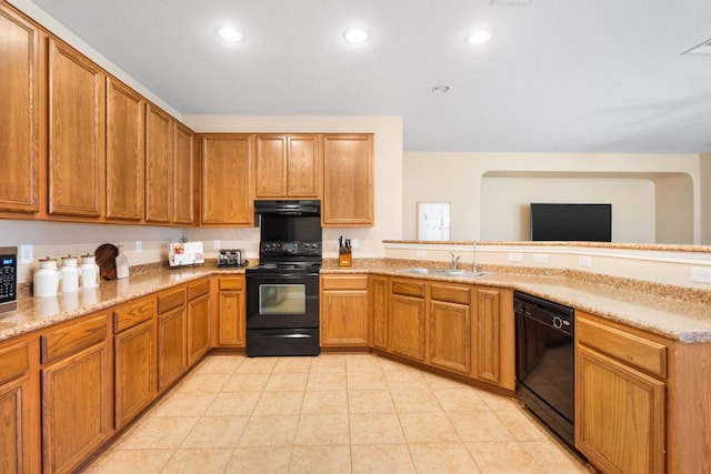 366 Matthews Ln, Kyle, TX 78640 - kitchen with black appliances, extractor fan, a peninsula, recessed lighting, and brown cabinetry