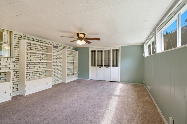 6009 Belfast Dr, Austin, TX 78723 - unfurnished bedroom with carpet floors, baseboards, and ceiling fan