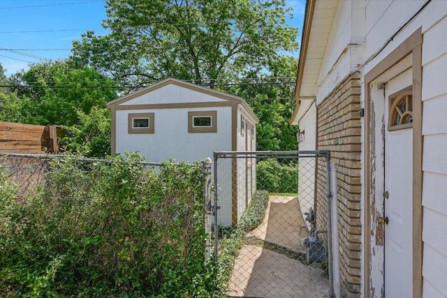 6009 Belfast Dr, Austin, TX 78723 - view of home's exterior with a gate and an outbuilding