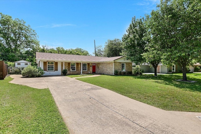 6009 Belfast Dr, Austin, TX 78723 - single story home featuring driveway, a front yard, and brick siding