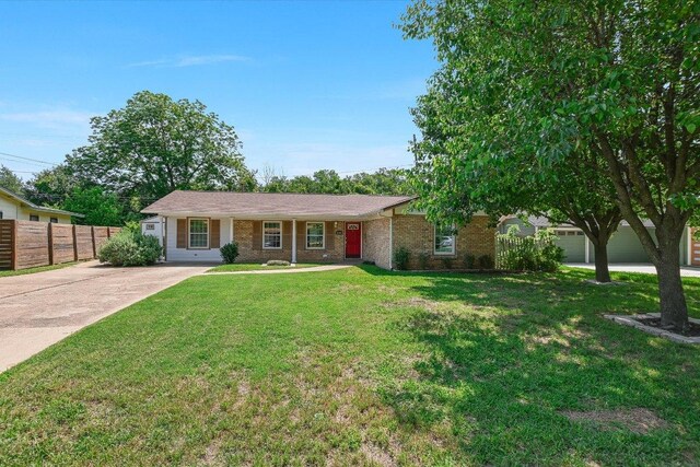 6009 Belfast Dr, Austin, TX 78723 - single story home with brick siding and concrete driveway