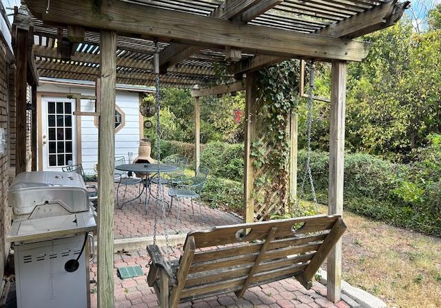 6009 Belfast Dr, Austin, TX 78723 - view of patio with a pergola, outdoor dining space, and grilling area