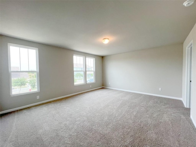 431 Ferrule Dr, Kyle, TX 78640 - carpeted spare room featuring baseboards and a smoke detector