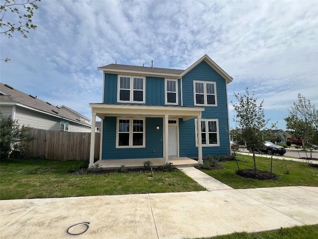 431 Ferrule Dr, Kyle, TX 78640 - traditional-style house with covered porch and board and batten siding