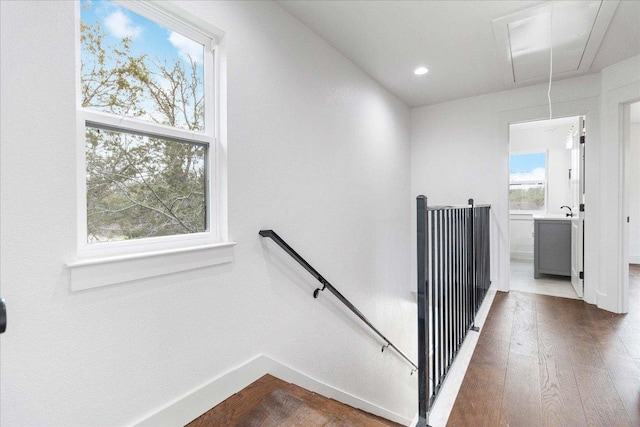 114 Shady Bluff Dr, Wimberley, TX 78676 - staircase featuring attic access, wood finished floors, baseboards, and recessed lighting