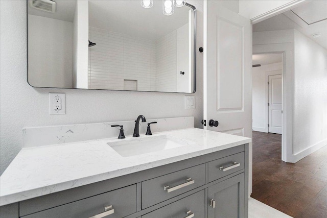 114 Shady Bluff Dr, Wimberley, TX 78676 - full bathroom with vanity, wood finished floors, and baseboards