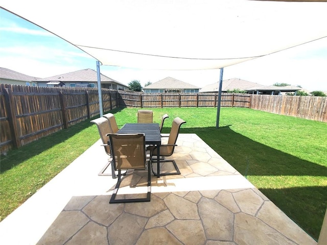 130 Navidad River Dr, Hutto, TX 78634 - fenced backyard with a patio area and outdoor dining area