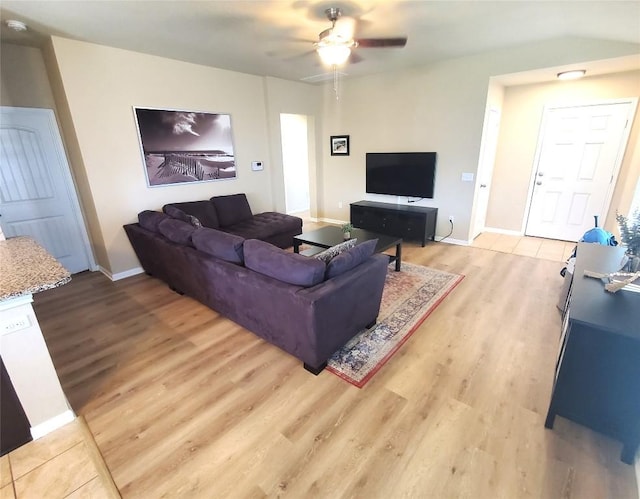 130 Navidad River Dr, Hutto, TX 78634 - living room with light wood-style floors, a ceiling fan, and baseboards