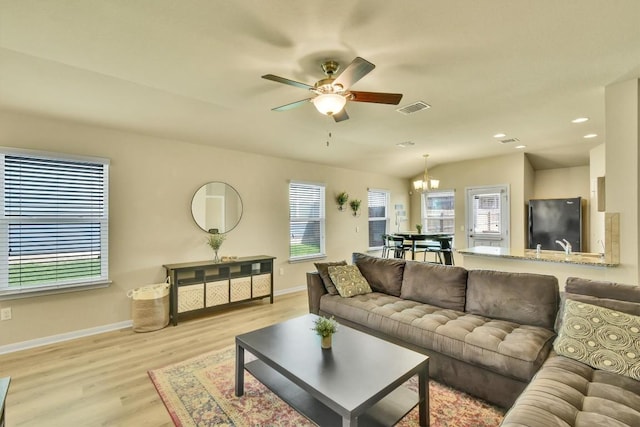 130 Navidad River Dr, Hutto, TX 78634 - living area featuring ceiling fan, light wood finished floors, a chandelier, and recessed lighting