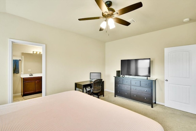 130 Navidad River Dr, Hutto, TX 78634 - bedroom featuring light colored carpet, ceiling fan, and connected bathroom