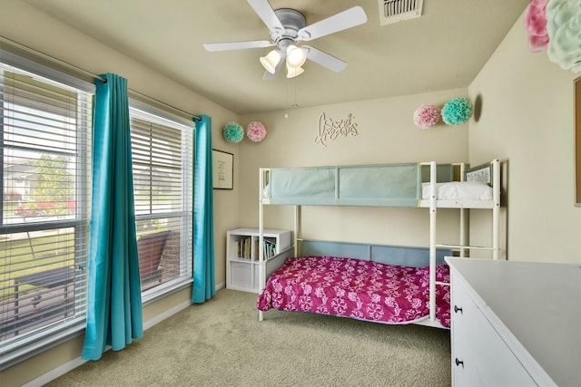 130 Navidad River Dr, Hutto, TX 78634 - carpeted bedroom with ceiling fan and baseboards
