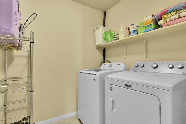 130 Navidad River Dr, Hutto, TX 78634 - laundry area with separate washer and dryer and light tile patterned floors