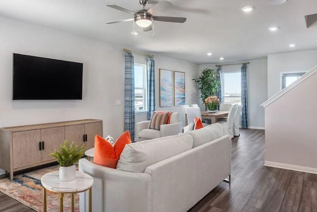 living area featuring dark wood-style flooring, baseboards, recessed lighting, and a ceiling fan