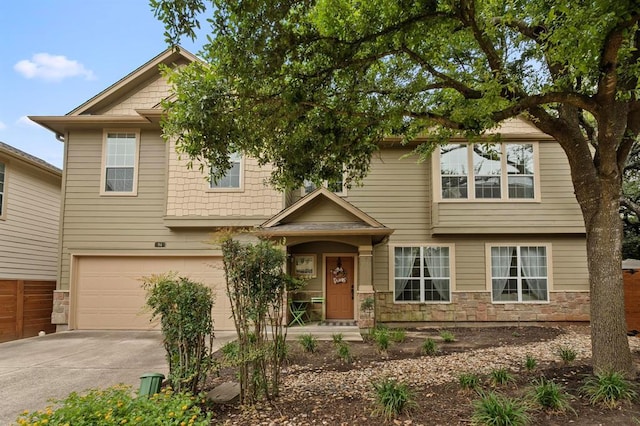 11000 Anderson Mill Rd Unit 84, Austin, TX 78750 - view of front of property with driveway, an attached garage, and stone siding
