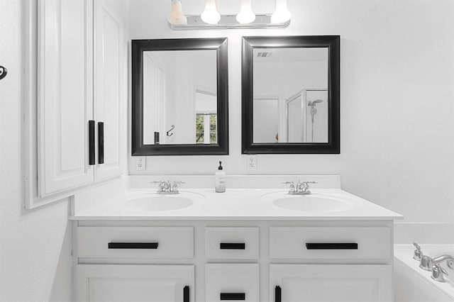 11000 Anderson Mill Rd Unit 84, Austin, TX 78750 - full bathroom featuring double vanity and a bath