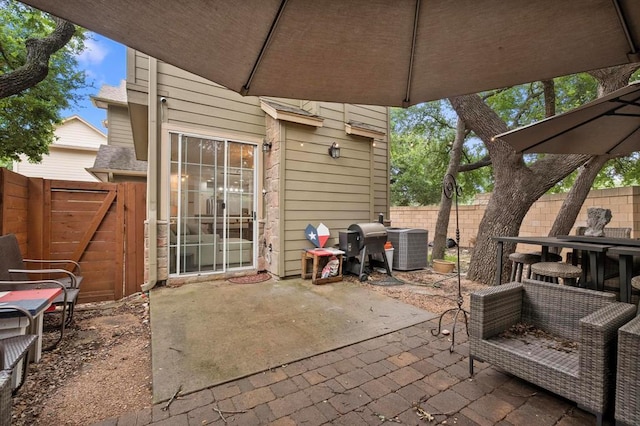 11000 Anderson Mill Rd Unit 84, Austin, TX 78750 - fenced backyard with a patio, central AC, and a grill