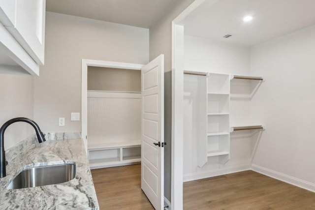 4007 Aerie St, Salado, TX 76571 - interior space featuring a sink, wood finished floors, and baseboards
