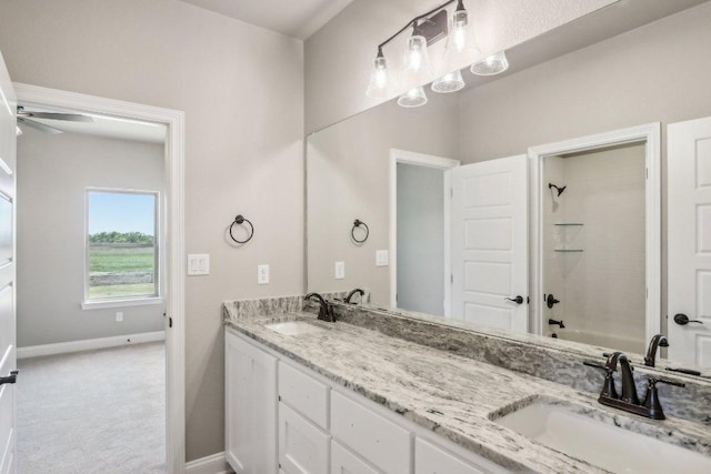 4007 Aerie St, Salado, TX 76571 - bathroom with double vanity, baseboards, shower / tub combination, and ceiling fan