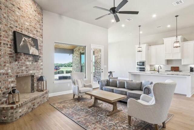 4007 Aerie St, Salado, TX 76571 - living room featuring ceiling fan, light wood finished floors, baseboards, and recessed lighting