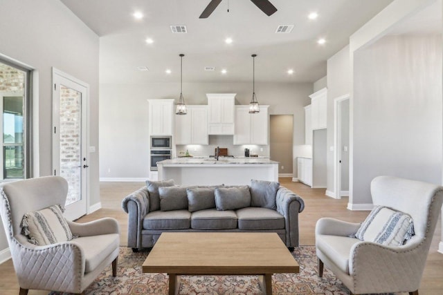 4007 Aerie St, Salado, TX 76571 - living room with ceiling fan, light wood-style floors, baseboards, and recessed lighting