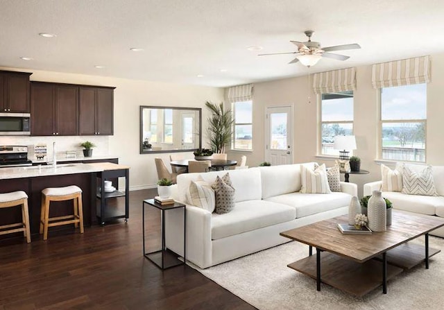 4005 Wynn Rd, Hutto, TX 78634 - living area with dark wood-type flooring, a ceiling fan, recessed lighting, and baseboards