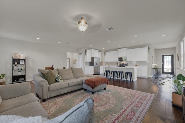 106 Mary Max Cv, San Marcos, TX 78666 - living area with a ceiling fan, recessed lighting, dark wood-style floors, and baseboards