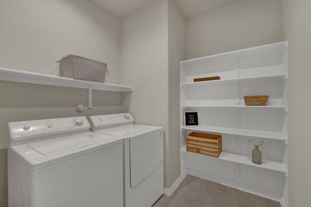 106 Mary Max Cv, San Marcos, TX 78666 - clothes washing area featuring separate washer and dryer, light tile patterned floors, and baseboards