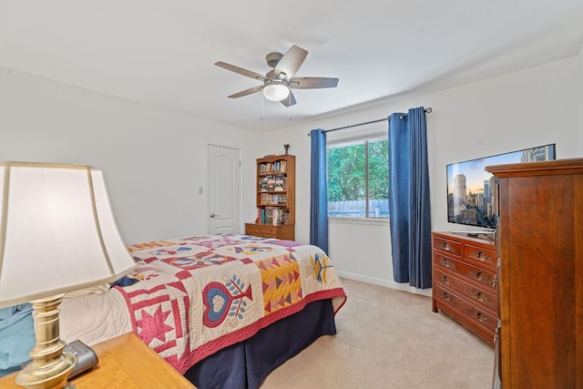 10109 Vaquero Trl, Austin, TX 78759 - bedroom with light colored carpet, ceiling fan, and baseboards