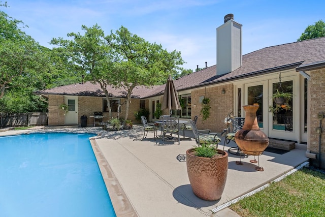 10109 Vaquero Trl, Austin, TX 78759 - view of swimming pool with a patio, fence, and area for grilling