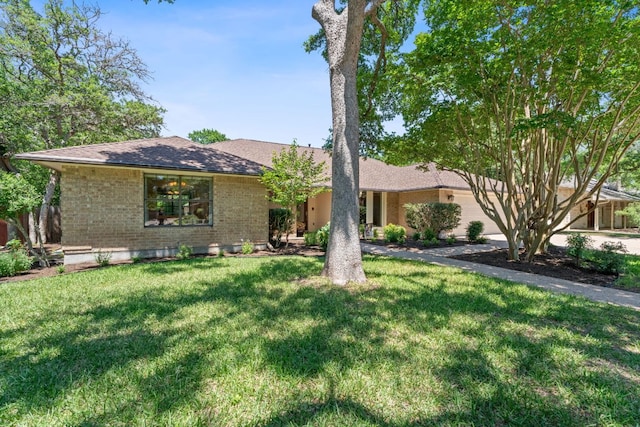 10109 Vaquero Trl, Austin, TX 78759 - ranch-style house with brick siding, a front yard, and roof with shingles