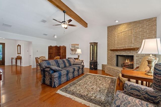 10109 Vaquero Trl, Austin, TX 78759 - living room featuring wood finished floors, ceiling fan, a brick fireplace, and baseboards