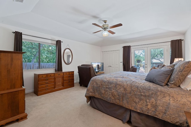10109 Vaquero Trl, Austin, TX 78759 - bedroom with a tray ceiling, multiple windows, access to exterior, and light colored carpet