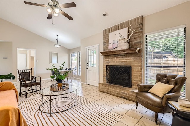 1711 Provident Ln, Round Rock, TX 78664 - living area featuring light tile patterned floors, lofted ceiling, a ceiling fan, a fireplace, and baseboards